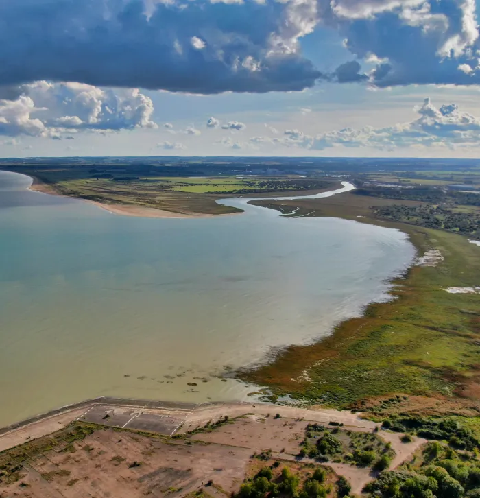A photo of Pegwell Bay from above, showing the stretch of land and the sea.