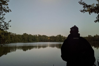 Back of a person looking across Sevenoaks lakes for Bats