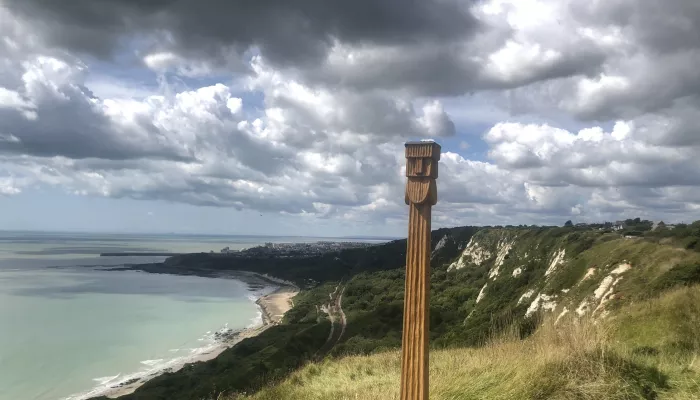 Perkunas totem pole with views from the top of capel-le-ferne cliffs down to the english channel