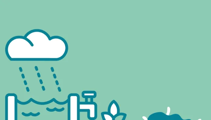 a water tank being rained on with a plan and compost heap beside