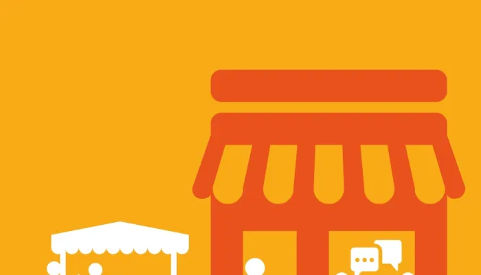 people chatting at a table, a person shopping and a small stall holder