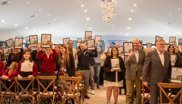 The crowd at the Wilder Kent Awards 2025 holding up their winner certificates.