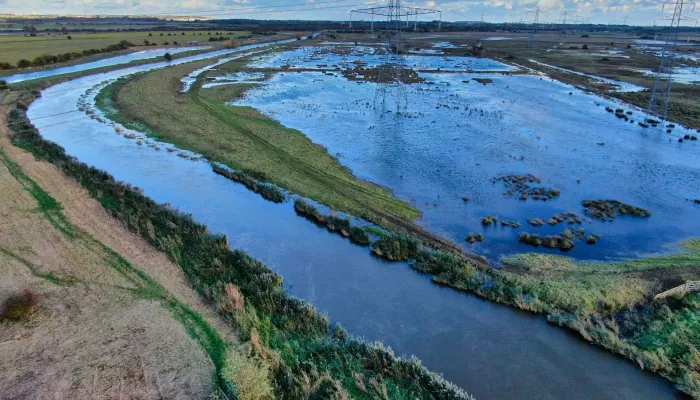 A photo of Minster Marshes with pylons in the background