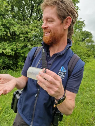 Matt Orwin with a 6-spot burnet moth