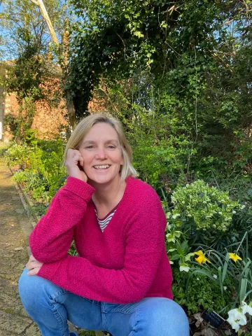 Sally Edge in her home garden, Langdon Court.