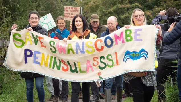 Swansombe Rally October 21 where campaigners hold banner saying "Save Swanscombe Peninsula SSSI"