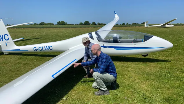 Lawrence KWT and Adrian Gliding club counting insect splats on glider wing for bugs matter