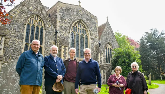 St Clement's churchyard volunteers posing with rob smith for the talk on the wild side podcast episode