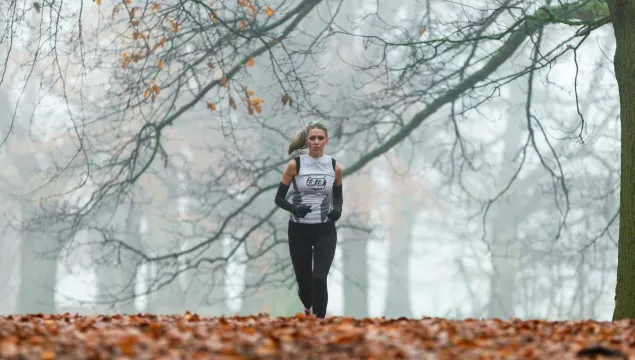 A person running in athletic clothes for a fundraiser
