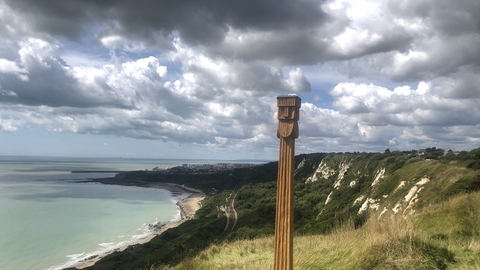 Perkunas totem pole with views from the top of capel-le-ferne cliffs down to the english channel