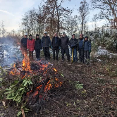 A bonfire is always a perk of winter task days, and helpfully gets rid of rhododendron cuttings.