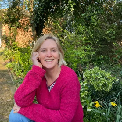 Sally Edge in her home garden, Langdon Court.