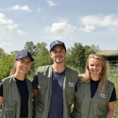 Heidi, Eddie, and Hannah, bison rangers standing in their uniforms.