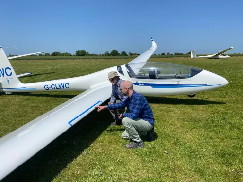 Lawrence KWT and Adrian Gliding club counting insect splats on glider wing for bugs matter