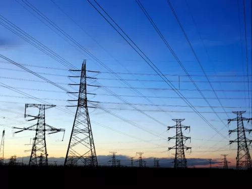 View from below of lots of pylons in the landscape