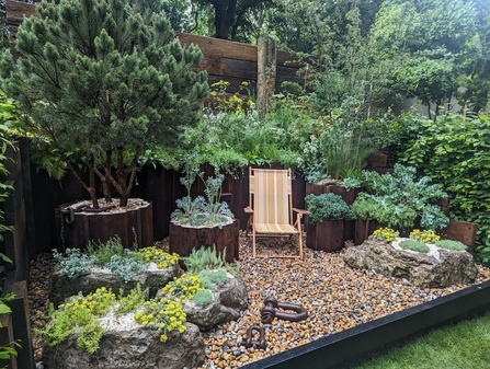 Chelsea Flower Show rock garden with a deck chair in the middle