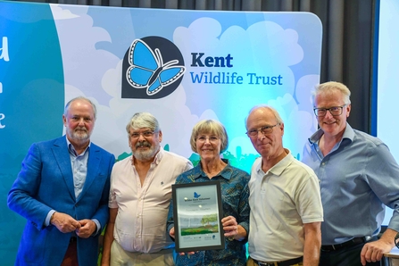 The Shoresearch team standing with a Wilder Kent Volunteer Award certificate.