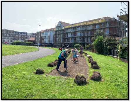 People digging turf in Cliftonville